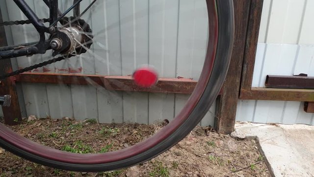 The Wheel spinning on an old bike. The wheel is spinning.