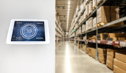 Industrial 4.0 , Artificial intelligence and smart warehouse logistic concept. Display screen of facial recognition for check in and order pick time around the world and supply chain in smart factory.