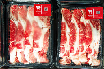 Artificial beef lab grown meat in retail supermarket emerging field of food production with label. Future trend of biotechnology ,  artificial food 4.0 concept.