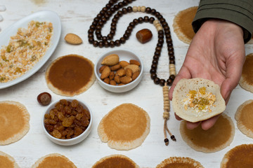 Qatayef - Muslim woman making katayef , traditional middle eastern sweets , usually eaten in Muslims holy month : Ramadan