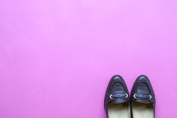 Brown women shoes on pink background