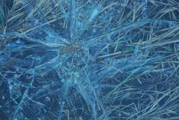 gray texture of dirty broken glass with cracks