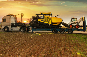 Road transport of heavy asphalt machinery