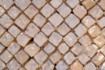 The texture of old squared stones close-up