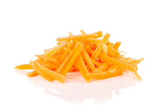 Lot of pieces of peeled fresh orange carrot cut into thin noodles isolated on white background