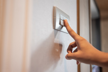 turning on or off on grey light switch.