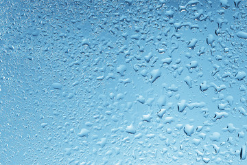 wet glass background condensate / abstract rain, drops texture on transparent glass