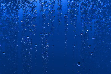 Plakat fresh drops background blue glass / wet rainy background, water drops transparent glass blue