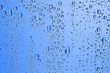fresh drops background blue glass / wet rainy background, water drops transparent glass blue