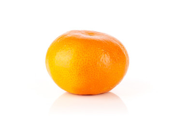 One whole fresh orange mandarine isolated on white background