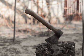 Ax in hemp. Ax sticks out of stump