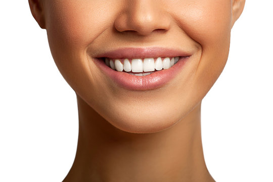 Smiling woman mouth with great teeth over isolated white background. Healthy beautiful girl smile. Concept teeth health, whitening, prosthetics and care