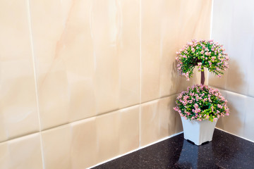 Plastic bouquet in a vase Decorate the wall corner in the shower