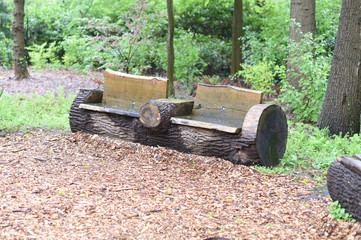 bench with tree trunks