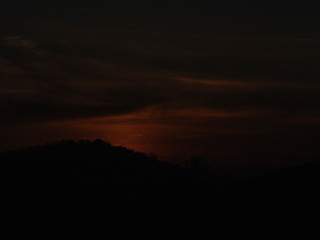 sunset time sun fall to mountain back side become to darkness 