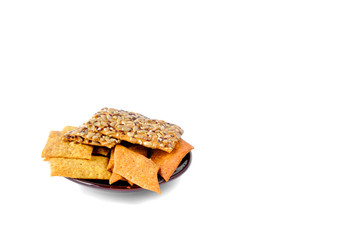 cookies with seeds on a plate on a white background