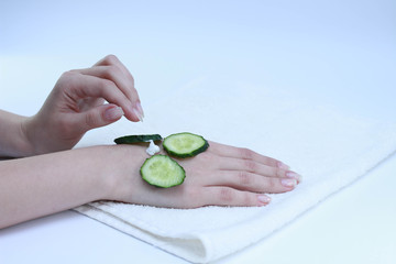 hands of a woman  cream cucumber