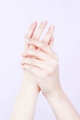 beautiful hands of a girl cream white background