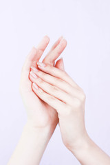 beautiful hands of a girl cream white background