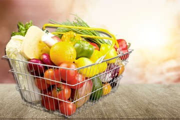 Full white shopping bag on bronw wooden background