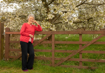 Naklejka na ściany i meble Happy senior woman outdoors 