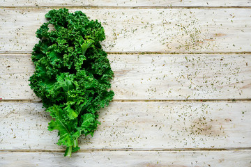 kale leaves on a rustic wooden table