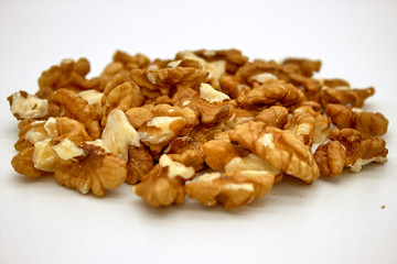 Walnut Kernels (Other Names: Juglans Regia, Persian Walnut, English Walnut, Circassian Walnut). Isolated Image On A White Background