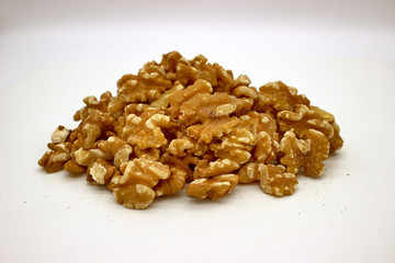 Walnut Kernels (Other Names: Juglans Regia, Persian Walnut, English Walnut, Circassian Walnut). Isolated Image On A White Background