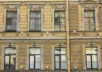 Old historical building facade with simple windows in Saint Petersburg, Russia. Classic traditional...
