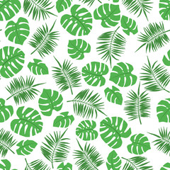 Tropical seamless pattern with palm and monstera leaves.