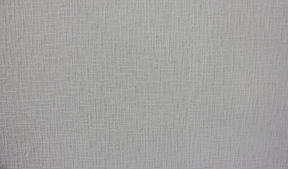Fototapeta na wymiar Textured light grey surface background of seamless wallpaper