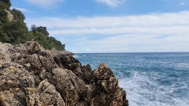 Relaxing Mediterranean Sea Waves Crashing On Rocks In Roquebrune-Cap-Martin In France, French Riviera, Europe - 4K Video