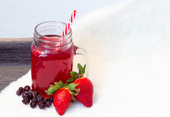 red strawberry and blueberry drink, berry juice, smoothie in a can
