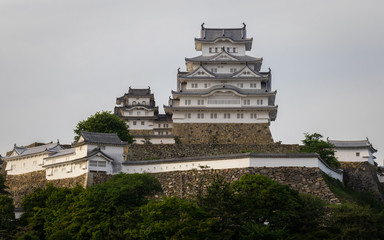 View on Himeji Castle on a clear, sunny day with many green around. Himeji, Hyogo, Japan, Asia.