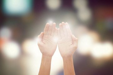 hand praying moslem with bokeh background