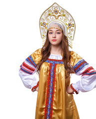Fototapeta premium Traditional Russian folk costume, portrait of a young beautiful girl