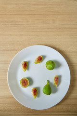 Fresh organic fig on white plate