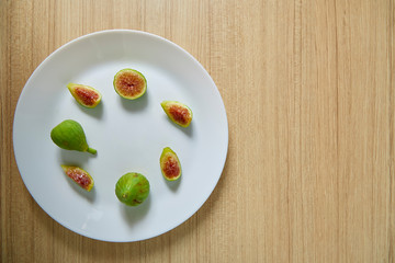 Fresh organic fig on white plate
