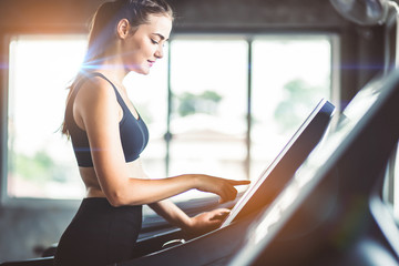 Healthy People running on machine treadmill at fitness gym, Work out concept.Picture of people...