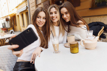 Girlfriends have fun in cafe