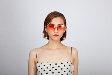 Chinese Girl wearing varies types of fashion sunglasses,looking sharp