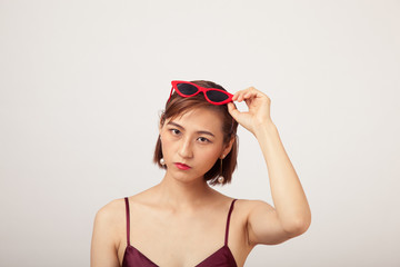 Chinese Girl wearing varies types of fashion sunglasses,looking sharp
