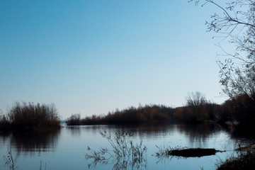 Autumn day in Arkhangelsk. Island Krasnoflotsky. the reflection in the water