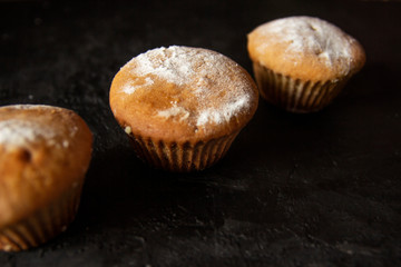Cakes on a dark stone background