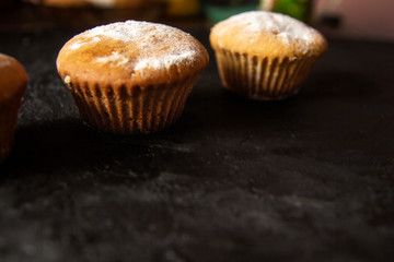 Cakes on a dark stone background
