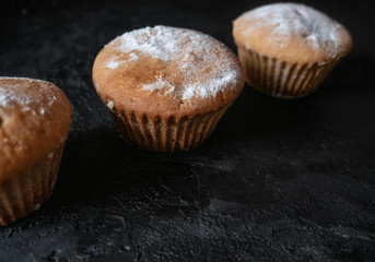Cakes on a dark stone background