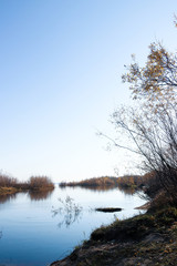 Autumn day in Arkhangelsk. Island Krasnoflotsky. the reflection in the water