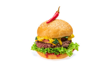 Tasty cheeseburger grilled cutlet, sesame bun,  tomato, onion, fresh lettuce and red chili peppers isolated on white background. Fastfood concept