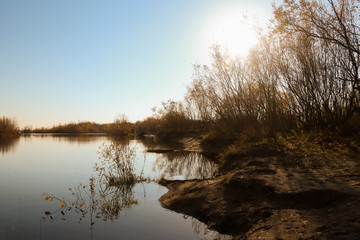 Naklejka na ściany i meble Autumn day in Arkhangelsk. Island Krasnoflotsky. the reflection in the water