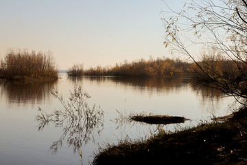 Autumn day in Arkhangelsk. Island Krasnoflotsky. the reflection in the water